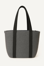 Gray woven crochet tote bag with black handles on a white background
