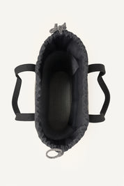 Top view of a gray woven crochet tote bag open showing the inside with black handles