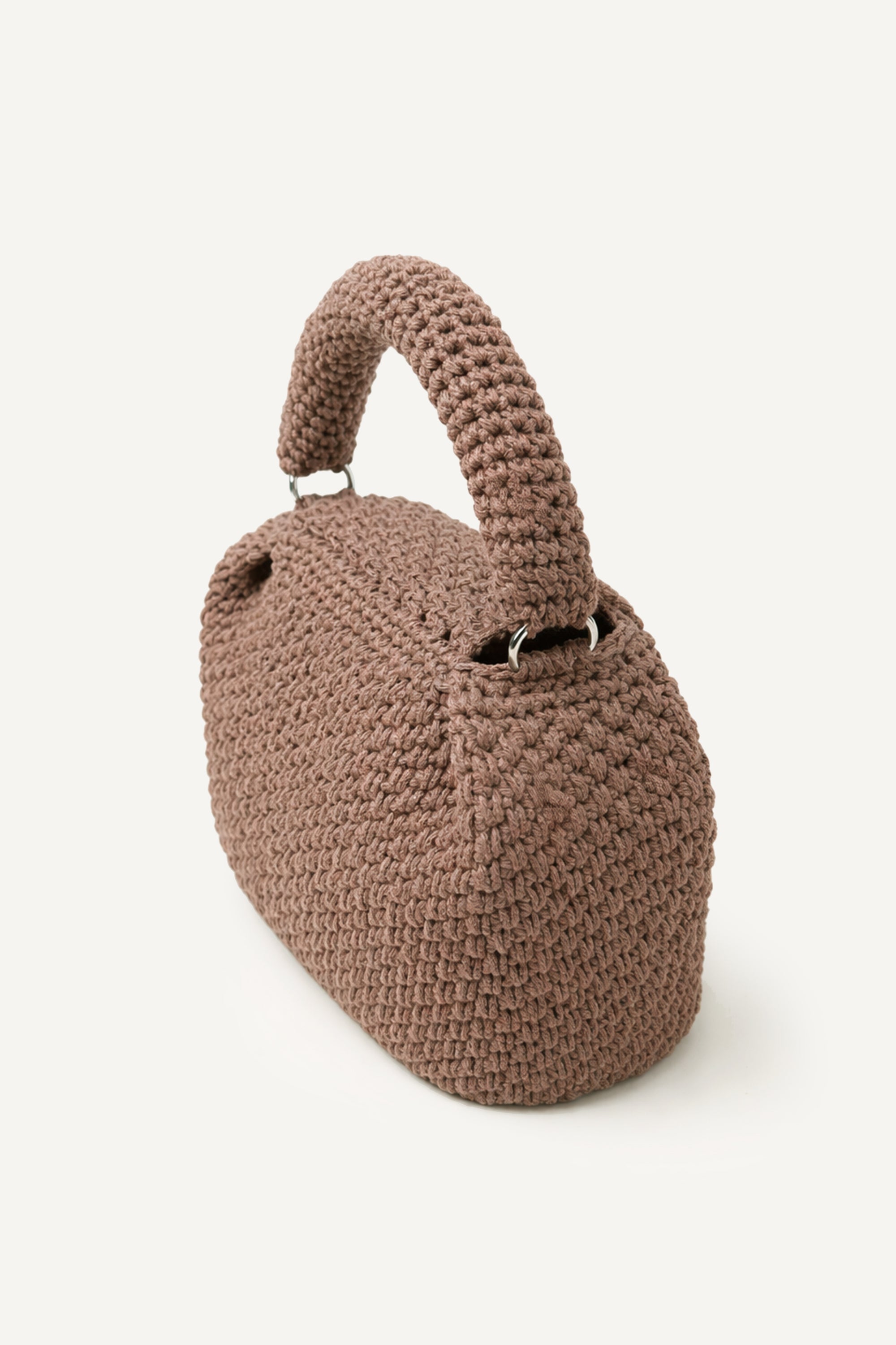 Angled back view of the woven brown Assos crochet top-handle bag with fringe detailing