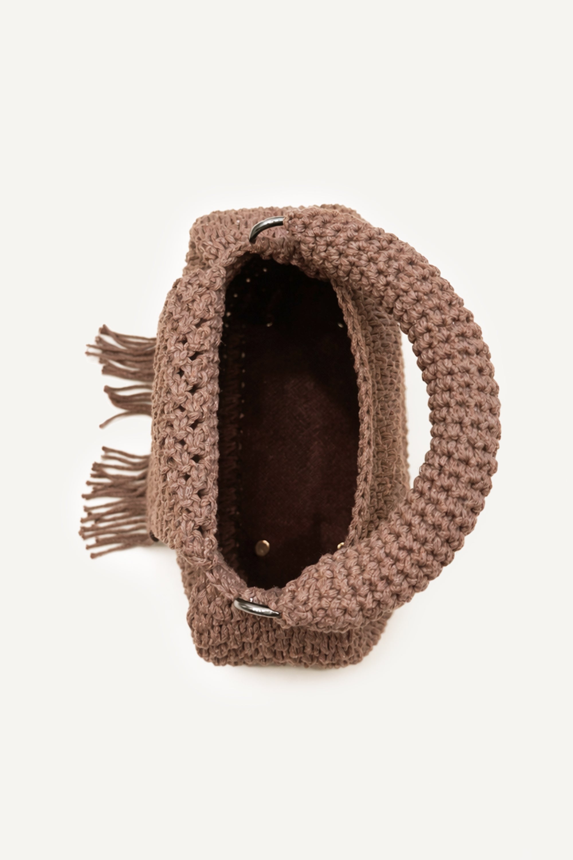 Top view of the woven brown Assos crochet top-handle bag with fringe detailing