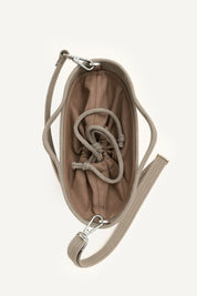 Top view of the beige capri cotton crochet crossbody bag with an adjustable strap and secure drawstring closure