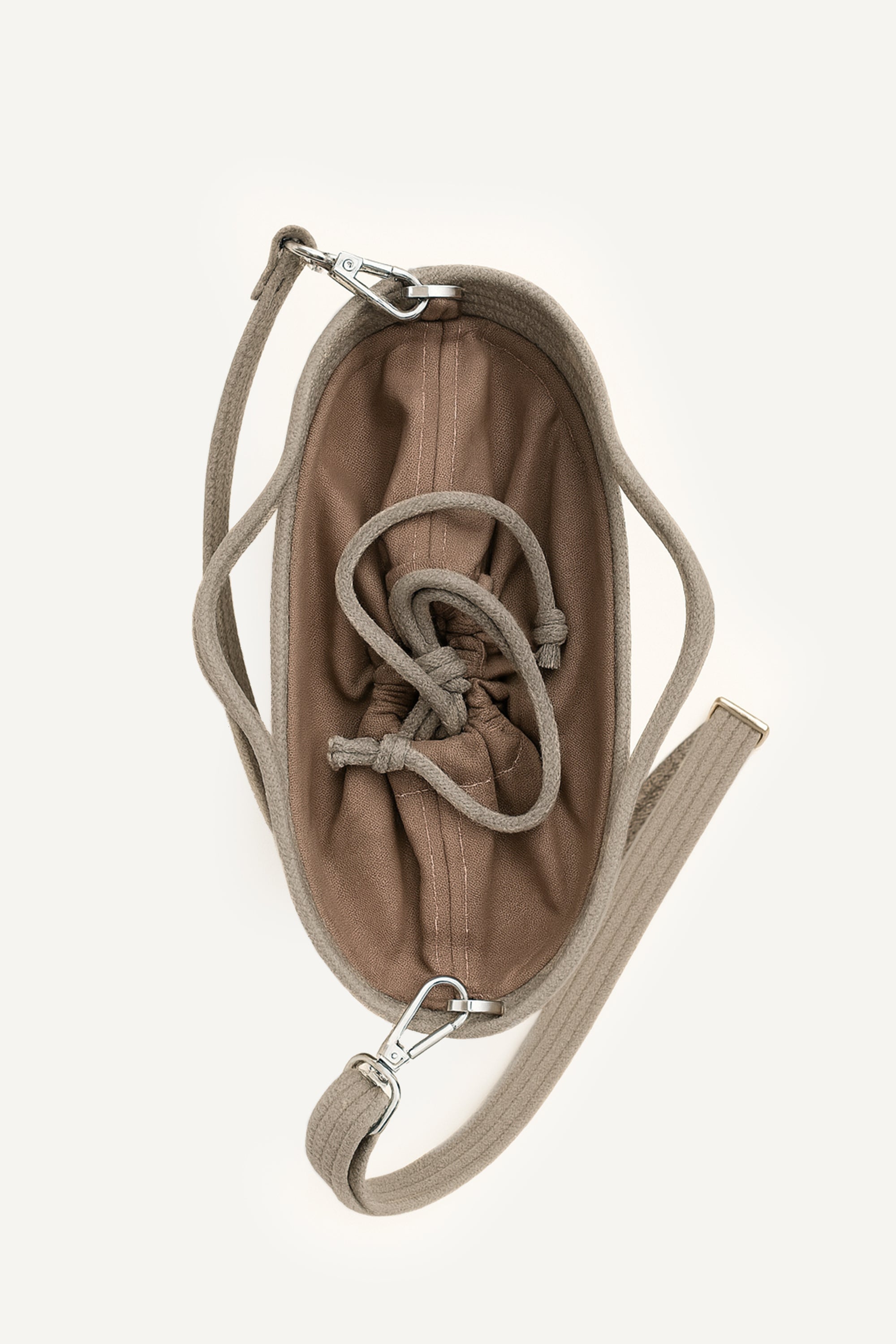 Top view of the beige capri cotton crochet crossbody bag with an adjustable strap and secure drawstring closure