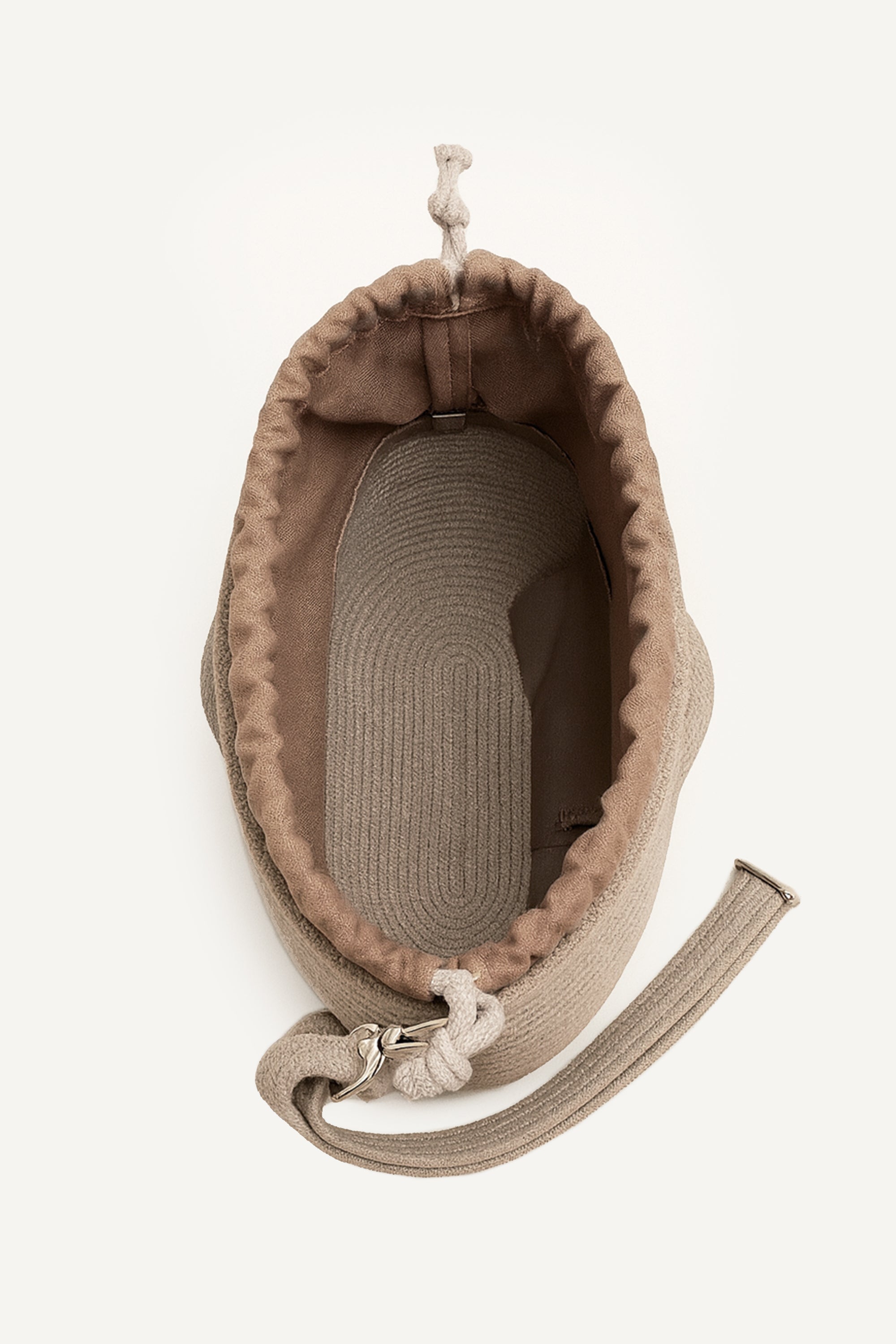 Top open view of the beige capri cotton crochet crossbody bag with an adjustable strap and secure drawstring closure