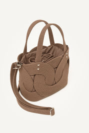 Top side view of the brown elba cotton crochet crossbody bag with an adjustable strap and secure drawstring closure