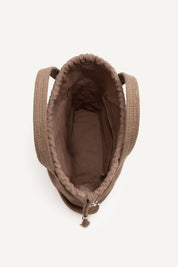 Top open view of the brown elba cotton crochet crossbody bag with an adjustable strap and secure drawstring closure