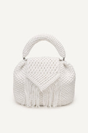 Front view of the white assos crochet top-handle bag with fringe detailing