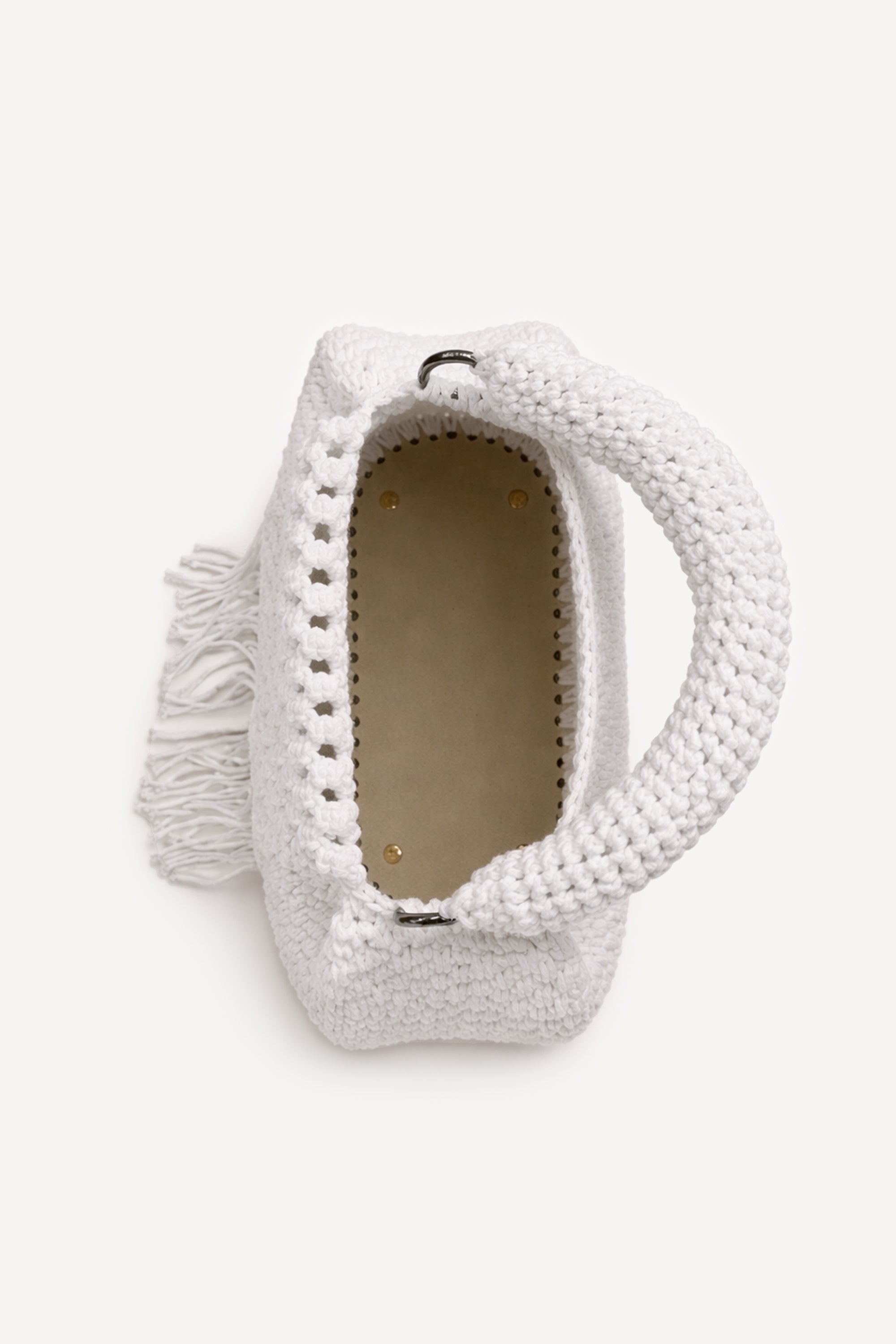 Top view of the woven white assos crochet top-handle bag with fringe detailing