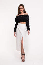 Full body view of Ardor Skirt by FemeAdor in white featuring a high-waisted, midi-length silhouette with delicate tailoring, ideal for both professional and casual styling