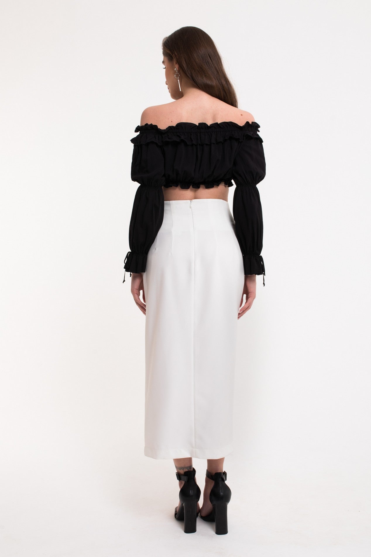 Back view of Ardor Skirt by FemeAdor in white featuring a high-waisted, midi-length silhouette with delicate tailoring, ideal for both professional and casual styling