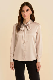 Front view of Charming Blouse by FemeAdor in beige with bowtie detail and flattering drape, ideal for professional and casual styling