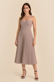 Front view of the Eclipse Demi Dress by FemeAdor in beige featuring a structured corset top and a flowing pleated midi skirt perfect for formal and casual events
