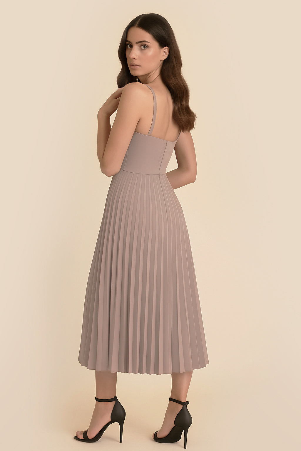 Back view of the Eclipse Demi Dress by FemeAdor in beige featuring a structured corset top and a flowing pleated midi skirt perfect for formal and casual events