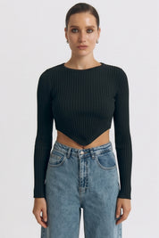 Front view of a woman wearing the black Cropped Longsleeve Top by FemeAdor featuring a flattering cropped cut and a cozy fitted ribbed knit design
