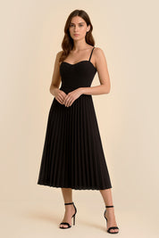 Front view of the Eclipse Demi Dress by FemeAdor in black featuring a structured corset top and a flowing pleated midi skirt perfect for formal and casual events
