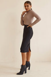 Side view of Liaison Skirt by FemeAdor in black featuring a sleek, figure-flattering midi silhouette, ideal for both professional and casual styling