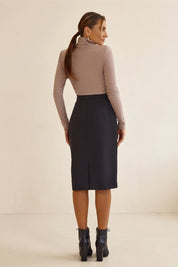Back view of Liaison Skirt by FemeAdor in black featuring a sleek, figure-flattering midi silhouette, ideal for both professional and casual styling