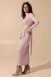Side view of the cozy Blush Midi Dress in soft pink angora fabric featuring a belted fit with long sleeves and turtle neck by FemeAdor