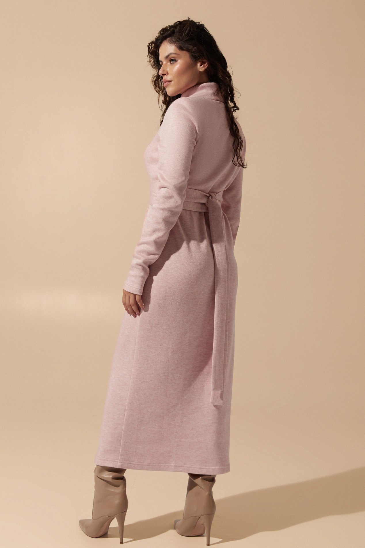 Back view of the cozy Blush Midi Dress in soft pink angora fabric featuring a belted fit with long sleeves and turtle neck by FemeAdor