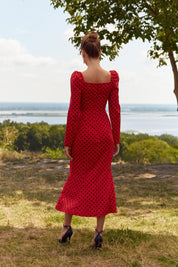 Back view of the Celestra Midi Dress by FemeAdor in red featuring a flattering fit-and-flare silhouette and timeless polka dot pattern