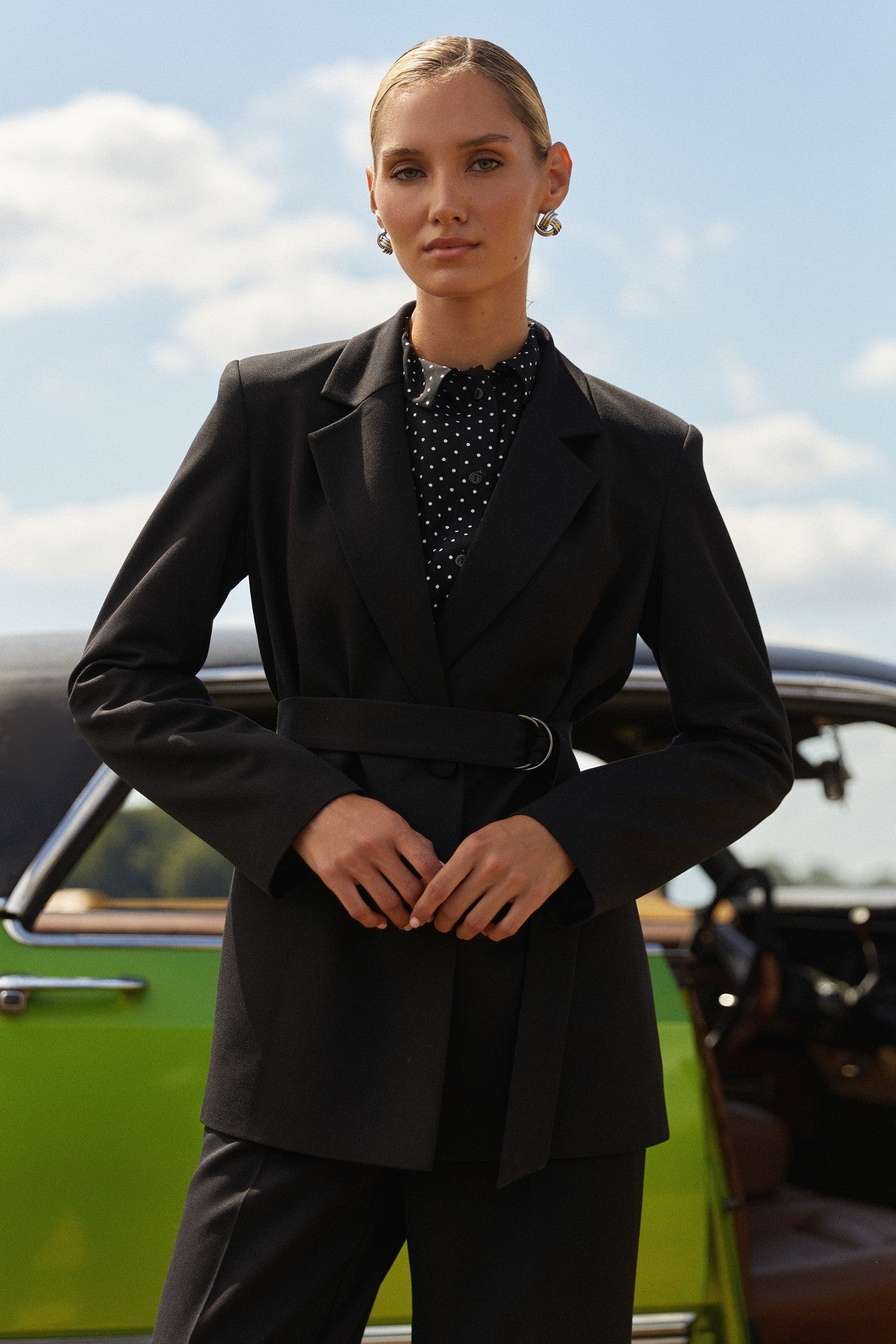 Front view of Continental Blazer by FemeAdor in black featuring a belted tailored silhouette, ideal for professional and casual styling