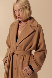 Close up of Elysian Overcoat by FemeAdor in brown with wide lapels and a tailored silhouette, ideal for fall and winter styling