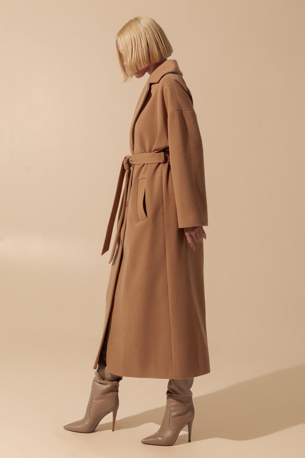 Side view of Elysian Overcoat by FemeAdor in brown with wide lapels and a tailored silhouette, ideal for fall and winter styling