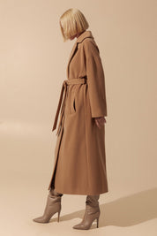 Side view of Elysian Overcoat by FemeAdor in brown with wide lapels and a tailored silhouette, ideal for fall and winter styling
