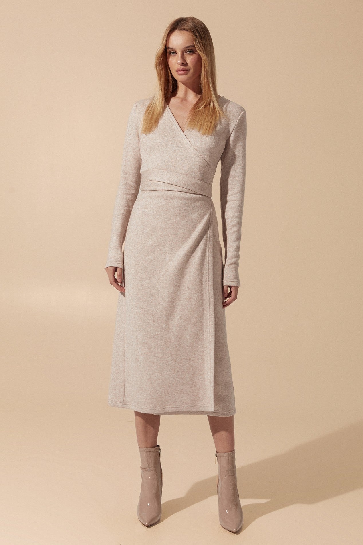 Front view of the Emberlyn Midi Dress in beige angora fabric with longsleeves and wrap around belt