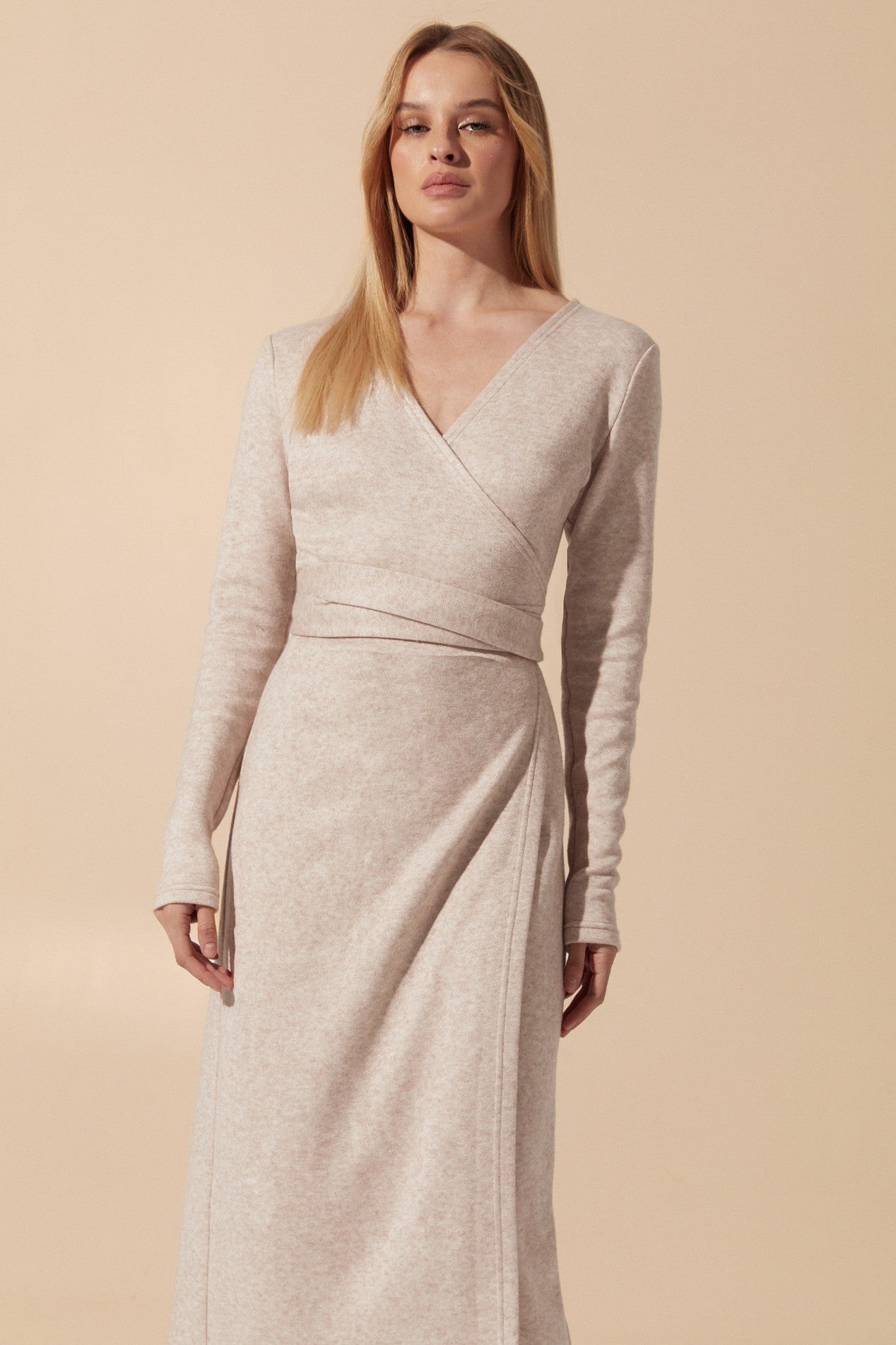 Close up view of the Emberlyn Midi Dress in beige angora fabric with longsleeves and wrap around belt