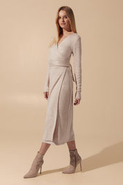 Slight side view of the Emberlyn Midi Dress in beige angora fabric with longsleeves and wrap around belt