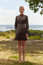 Full body view of the Floral Mini Dress by FemeAdor in black with delicate floral print, stand-up collar, and flattering fit
