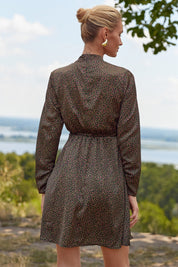 Back view of the Floral Mini Dress by FemeAdor in black with delicate floral print, stand-up collar, and flattering fit