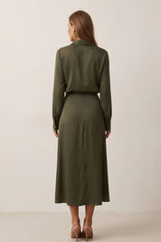 Back view of Nora Skirt by FemeAdor in green featuring a silk-like finish and flattering midi silhouette, ideal for various occasions