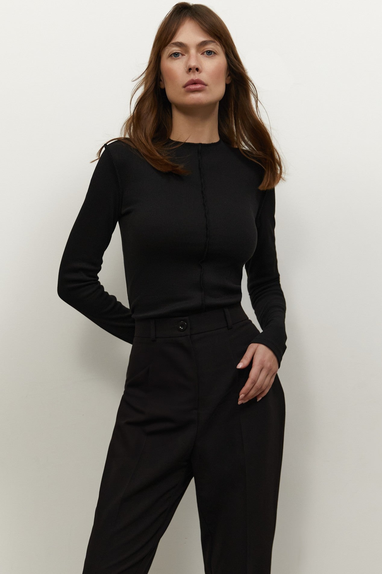 Front view of Knitted Longsleeve by FemeAdor in black featuring a soft, breathable fabric and flattering fit, ideal for layering or wearing on its own