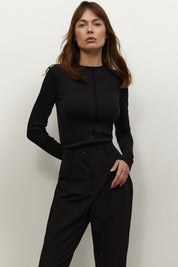 Front view of Knitted Longsleeve by FemeAdor in black featuring a soft, breathable fabric and flattering fit, ideal for layering or wearing on its own