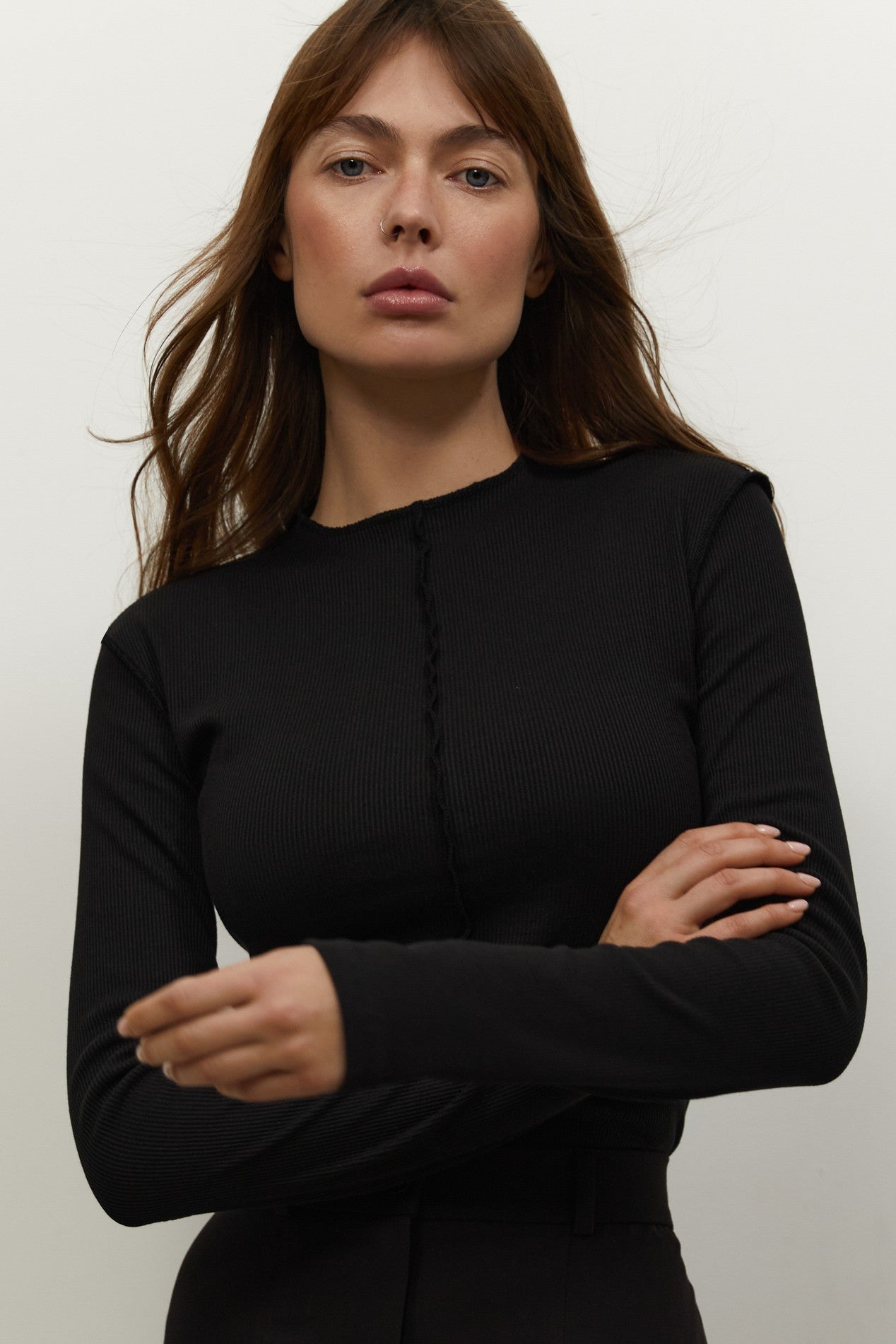Close up view of Knitted Longsleeve by FemeAdor in black featuring a soft, breathable fabric and flattering fit, ideal for layering or wearing on its own