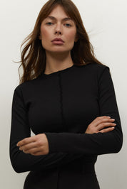 Close up view of Knitted Longsleeve by FemeAdor in black featuring a soft, breathable fabric and flattering fit, ideal for layering or wearing on its own