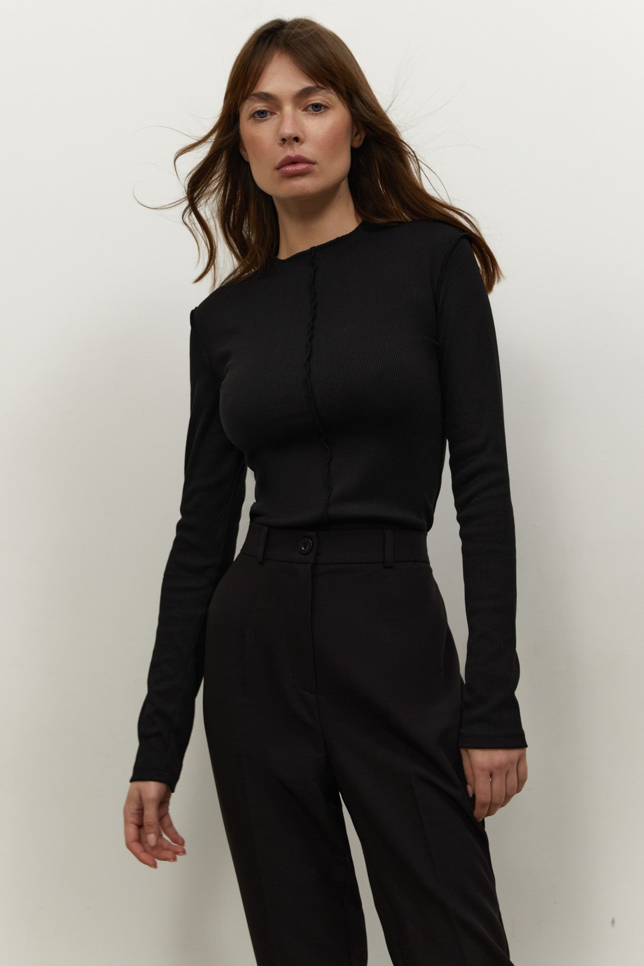 Another front view of Knitted Longsleeve by FemeAdor in black featuring a soft, breathable fabric and flattering fit, ideal for layering or wearing on its own