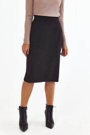 Close up of Liaison Skirt by FemeAdor in black featuring a sleek, figure-flattering midi silhouette, ideal for both professional and casual styling