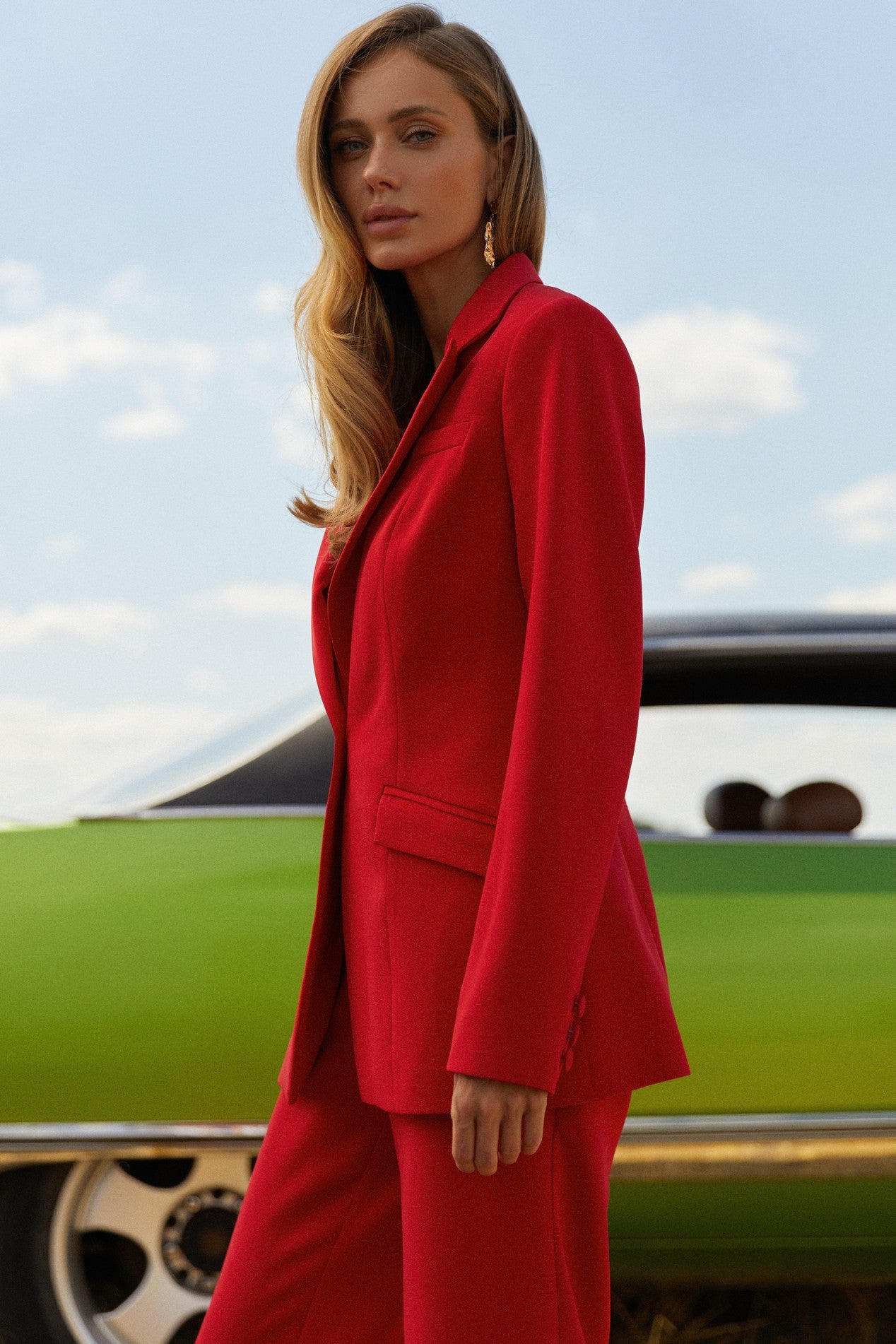 Side view of Moda Blazer in red featuring a tailored silhouette, ideal for both casual and formal styling