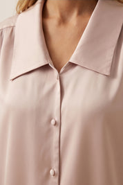 Close up view of a woman wearing the pink Timeless Blouse by FemeAdor featuring a flattering fit, ideal for layering or wearing solo in professional and casual settings.