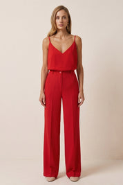 Front view of a woman wearing red Moda Trousers by FemeAdor featuring a high-waisted, wide-leg tailored fit for modern styling