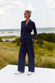 Full body view of Regal Trousers by FemeAdor in navy blue with high-waisted, wide-leg tailored fit, perfect for professional and casual styling