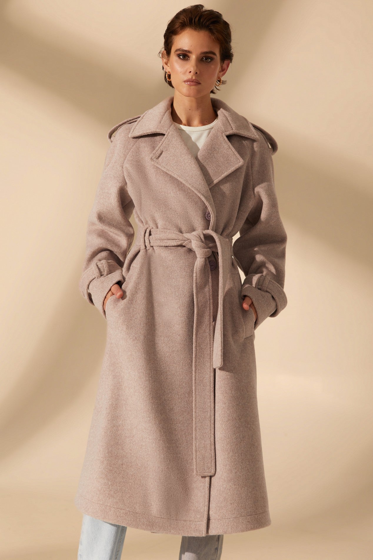 Front view of Royale Overcoat by FemeAdor in beige featuring wide lapels and a tailored silhouette, ideal for both professional and casual styling