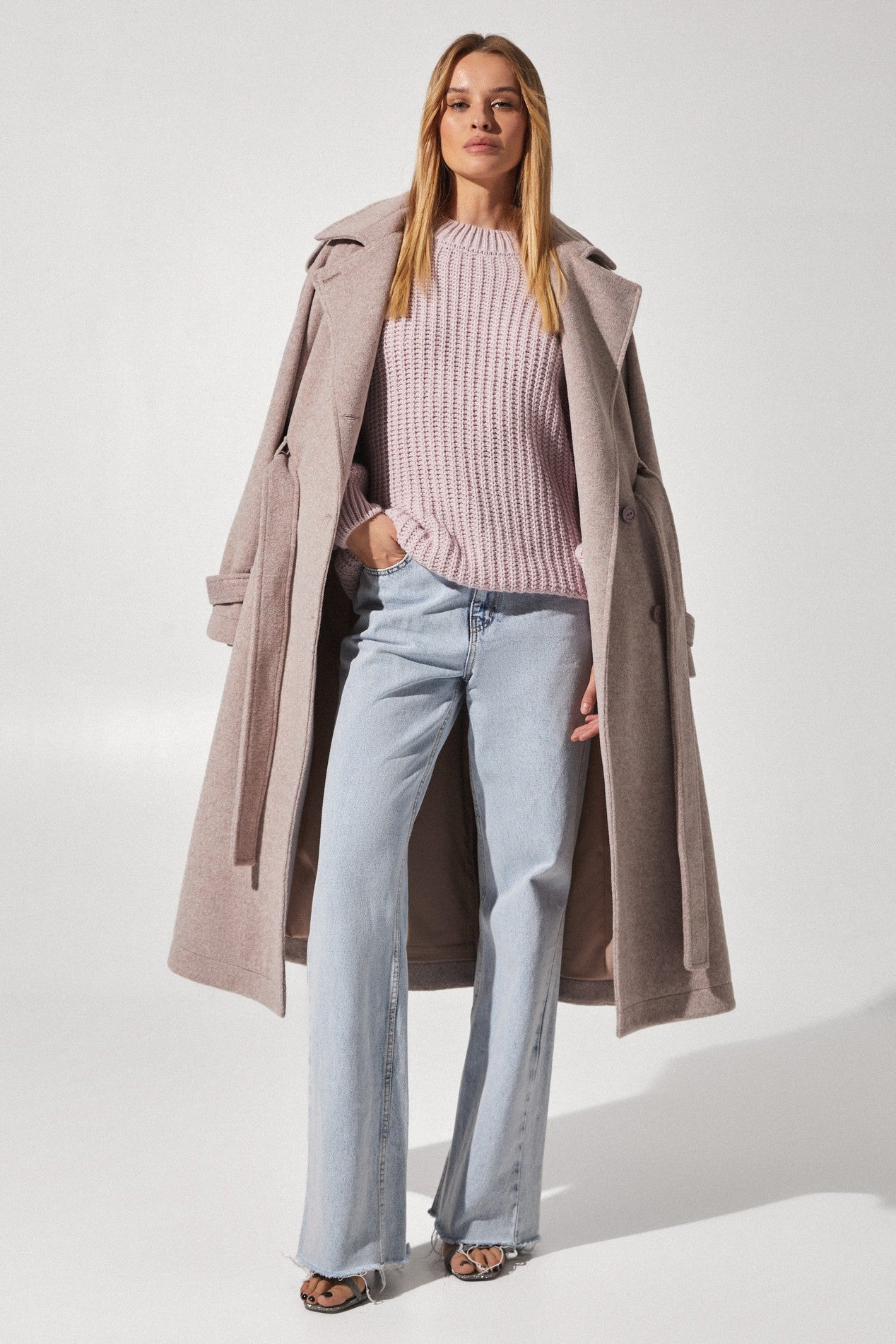 Hanging on Royale Overcoat by FemeAdor in beige featuring wide lapels and a tailored silhouette, ideal for both professional and casual styling