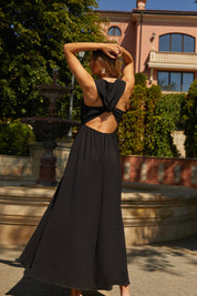 Back view of the Virella Maxi Dress in black with sleeveless design, open back, and floor-length silhouette for elegant evening wear