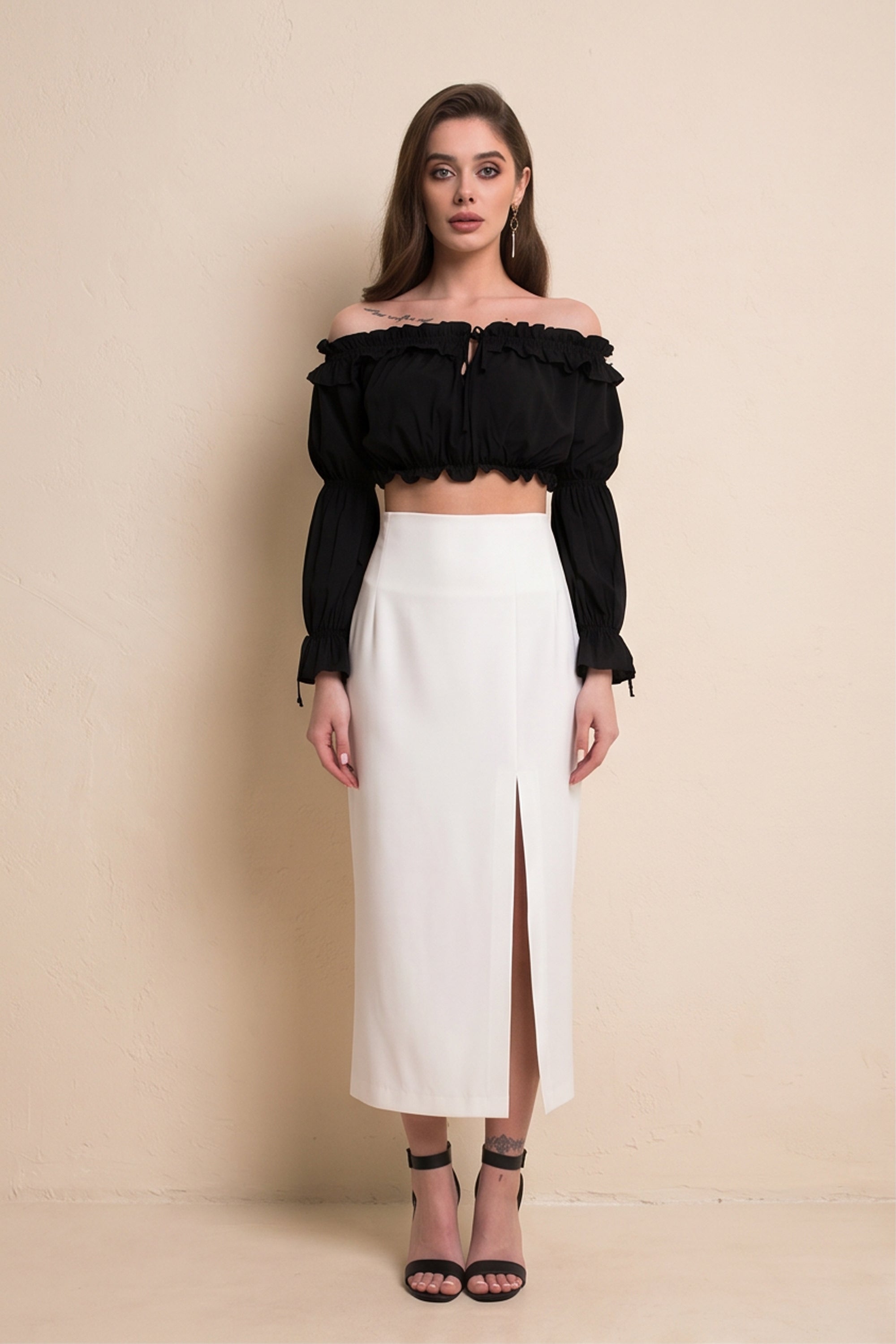 Front view of Ardor Skirt by FemeAdor in white featuring a high-waisted, midi-length silhouette with delicate tailoring, ideal for both professional and casual styling