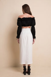 Back view of Ardor Skirt by FemeAdor in white featuring a high-waisted, midi-length silhouette with delicate tailoring, ideal for both professional and casual styling